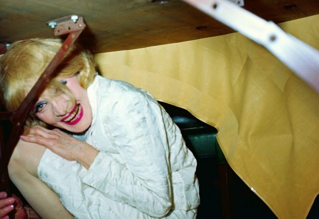 Marlene Dietrich hiding under a table on October 13, 1967 in New York City.