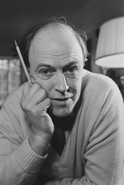 Roald Dahl holding a pencil