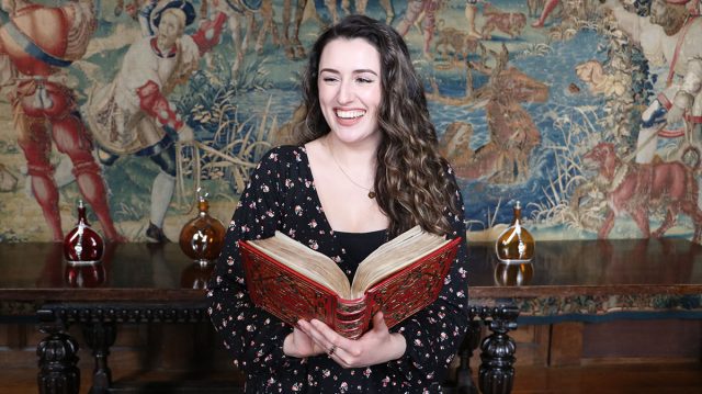 Kate McCaffrey poses with Anne Boleyn's Book of Hours