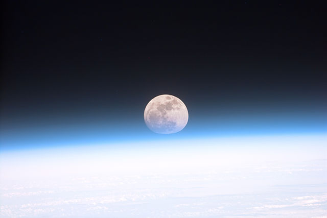 Full moon partially obscured by the Earth's atmosphere