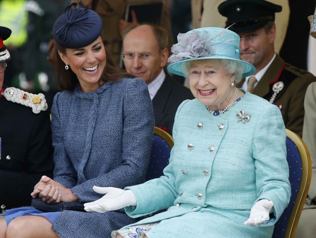 Catherine, Duchess of Cambridge and Queen Elizabeth II watch part of a children's sports event while visiting Vernon Park during a Diamond Jubilee visit to Nottingham on June 13, 2012 in Nottingham, England.