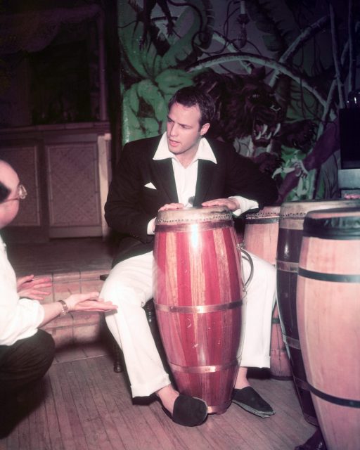 Marlon Brando playing the conga run, 1965. 