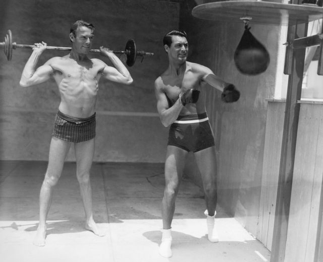 Randolph Scott and Carey Grant working out 