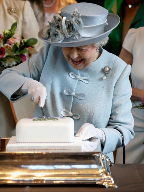 Sophie, Countess of Wessex and Princess Anne, Princess Royal look on as Queen Elizabeth II cuts a Women's Institute Celebrating 100 Years cake at the Centenary Annual Meeting of The National Federation Of Women's Institute at the Royal Albert Hall on June 4, 2015 in London, England. 