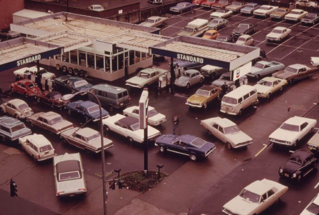Cars lined up at a gas station