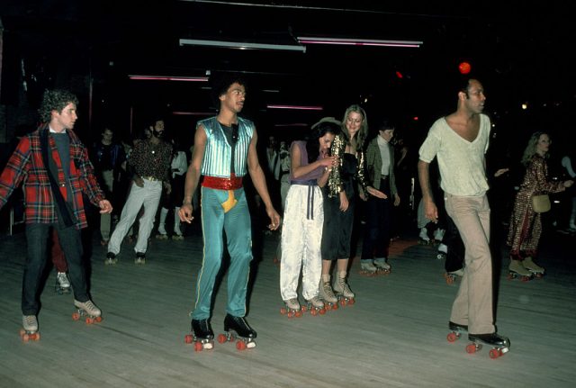 People rollerskating at a roller disco