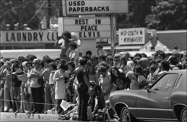 Fans gather on the street during Elvis Presley's funeral