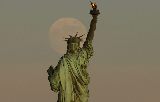 Moonrise over the statue of Liberty