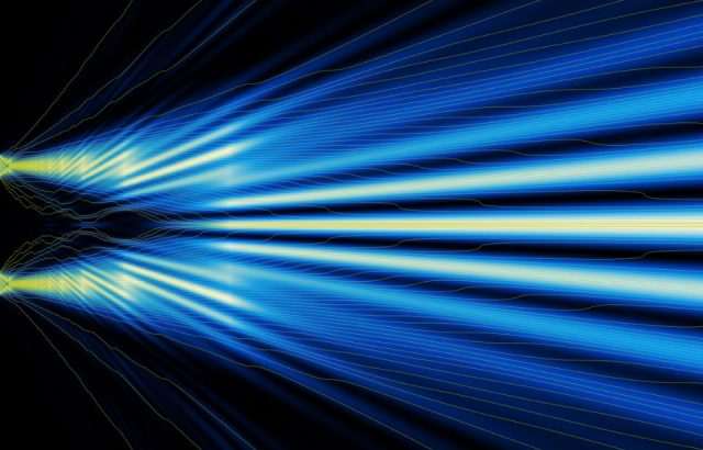trajectory of light as a wave through double-slit experiment.