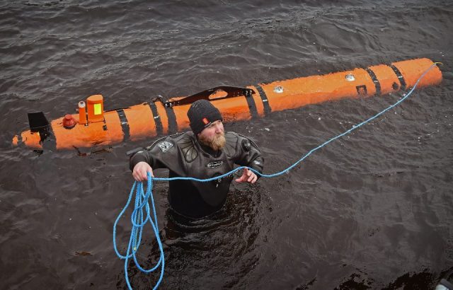 John Haig an engineer moves a Munin robot, operated by Norwegian company Kongsberg Maritime in Loch Ness on April 13, 2016 in Drumnadrochit, Scotland The Norwegian company Kongsberg, which has been surveying the loch came across remains of a thirty metre model of the Loch Ness Monster, from the 1970 film The Private Life of Sherlock Holmes, discovered down on the loch bed by the underwater robot.