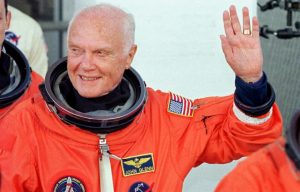 John Glenn wearing the orange partial-pressure launch and entry suit