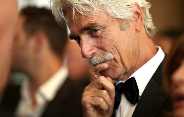 Sam Elliott stroking his mustache