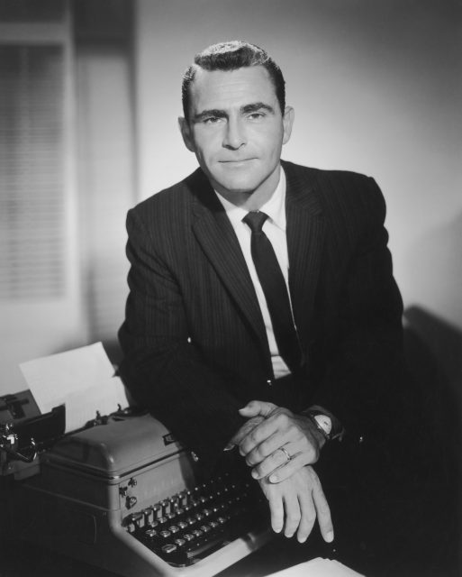 Screenwriter and television producer Rod Serling (1924-1975) pictured leaning on a typewriter, USA, circa 1955. Serling is best known for being the narrator on US series 'The Twilight Zone'. 