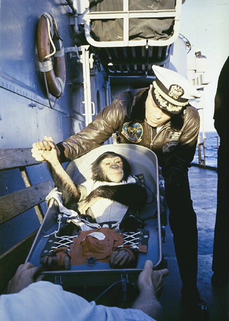 Ham shaking hands with Commander Ralph A. Brackett 