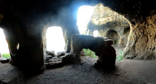 Rock pillars in the shadow of the bright, natural light outside