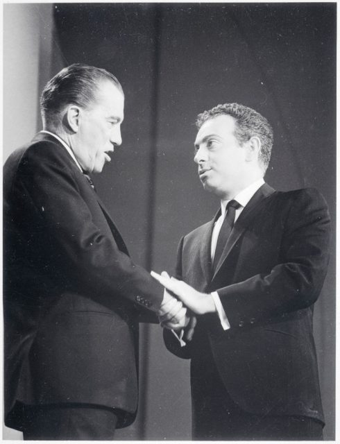 Ed Sullivan shaking hands with Jackie Mason