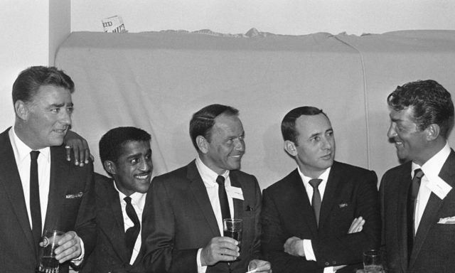 The five members of the Rat Pack standing side-by-side in suits