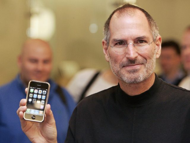 Steve Jobs with the first iPhone 