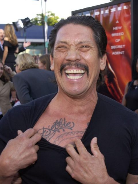 Danny Trejo shows off one of his tattoos