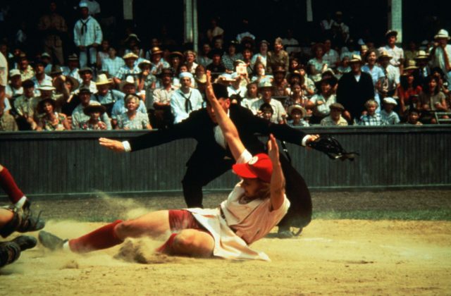 Geena Davis sliding into home plate