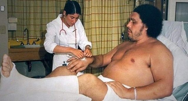 Andre the Giant being cared for by a nurse