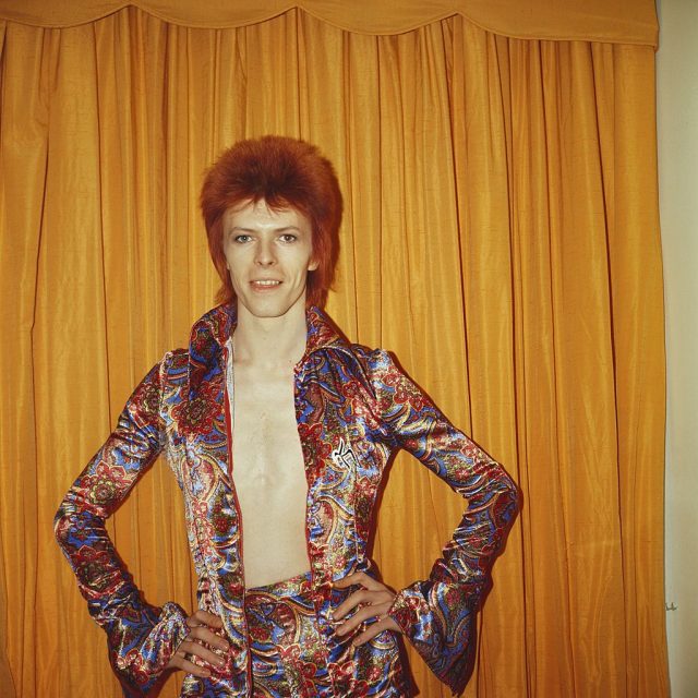 Rock and roll musician David Bowie poses for a portrait dressed as ‘Ziggy Stardust’ in a hotel room in New York City, New York. (Photo Credit: Michael Ochs Archives/Getty Images)