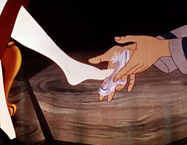 Cinderella trying on her glass slipper 