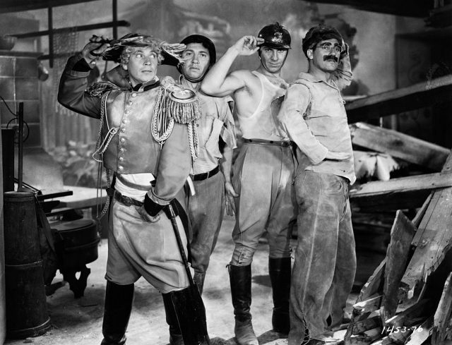 The Marx Brothers (from left): Harpo, Chico, Zeppo and Groucho Marx salute on the set of their classic 1933 film Duck Soup. They play Pinky, Lt. Bob Roland, Chicolini, and Rufus T. Firely, respectively, in the film. (Photo Credit: John Springer Collection/CORBIS/Corbis via Getty Images)