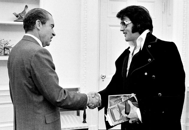 Richard Nixon and Elvis Presley shake hands 