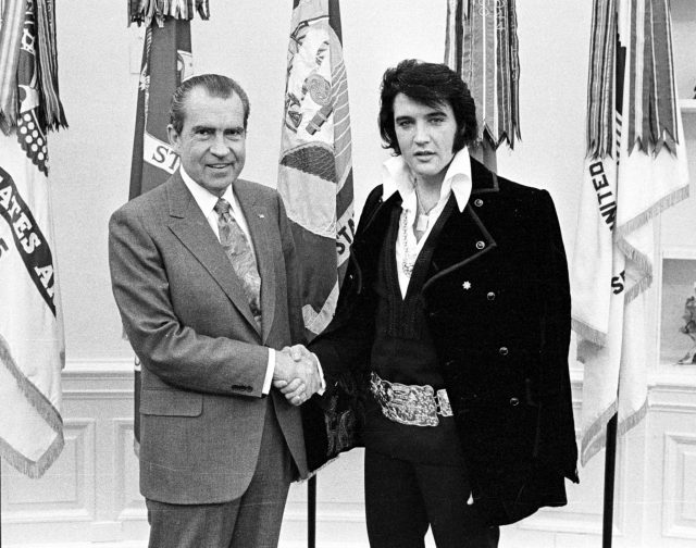 Richard Nixon and Elvis Presley shake hands 