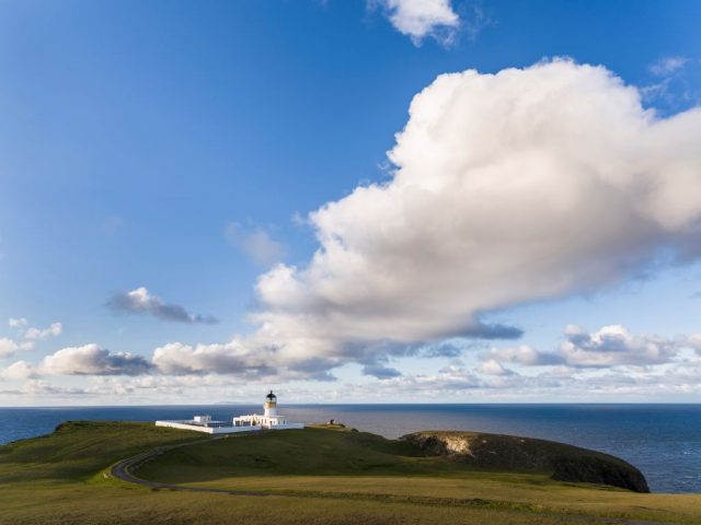 Fair Isle's lighthouse along the coast