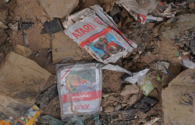 closeup of the dump showing an E.T. cartridge and a Centipede game