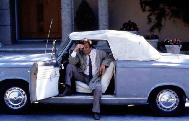 Peter Falk as Columbo in his beat-up Puegeot car.