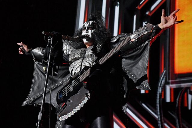 Gene Simmons singing into a microphone