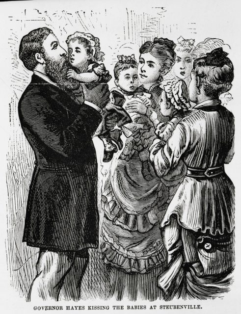 Governor Hayes kissing babies, circa 1900 