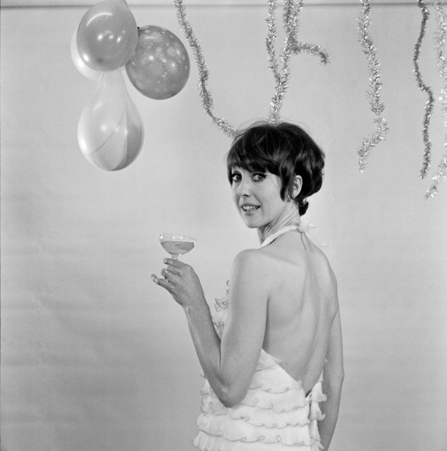 Una Stubbs wishes everyone a Happy New Year from the TV Centre, BBC Wood Lane, West London, 23rd December 1966. (Photo Credit: George Greenwell/Mirrorpix/Getty Images)