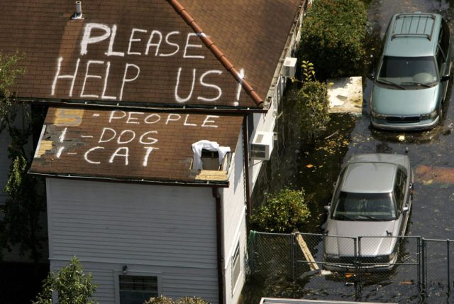 Aerial view of a home surrounded by floodwaters