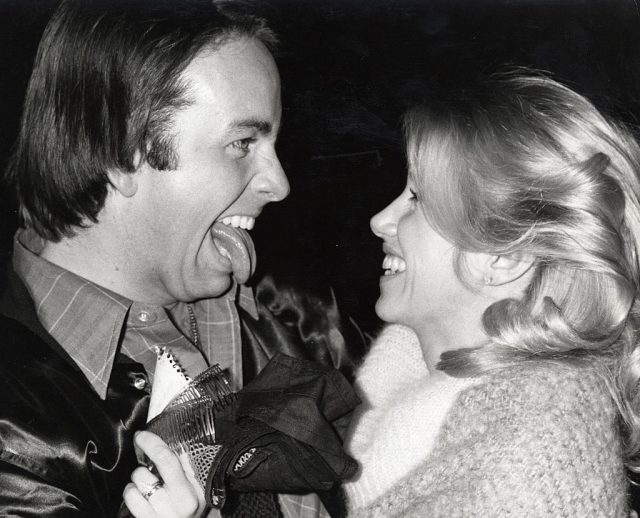 John Ritter sticking his tongue out at Suzanne Somers