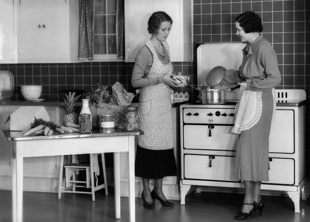 Two women standing in a kitchen