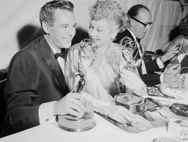Desi and Lucy Arnaz are shown with "Emmy" awards for I Love Lucy Show.