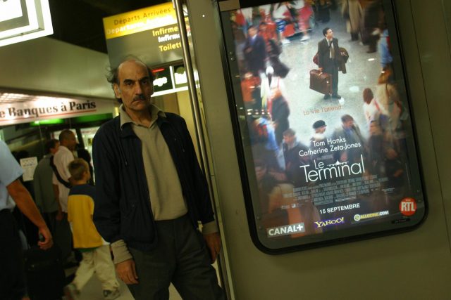 Sir Alfred poses next to a Terminal poster