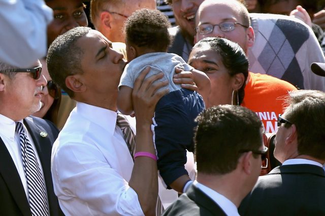 President Obama kissing a baby 