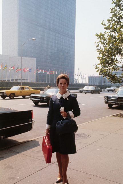 Shirley Temple standing on the street outside the United Nations