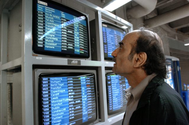 Mehran Karimi Nasseri looking at monitors 