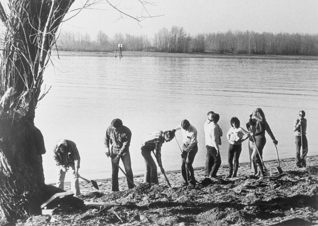 Investigators digging along the riverbank