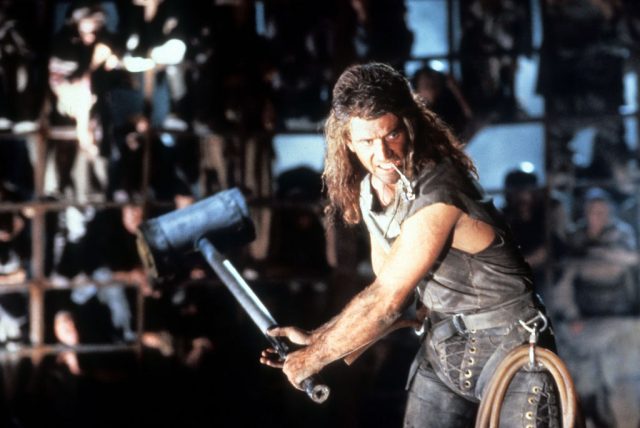 Mel Gibson swinging a mallet in a scene from the film ‘Mad Max Beyond Thunderdome’, 1985. (Photo Credit: Warner Brothers/Getty Images)