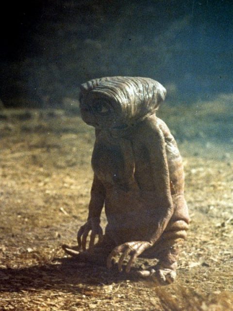 ET standing in a scene from the film 'E.T. The Extra-Terrestrial', 1982.