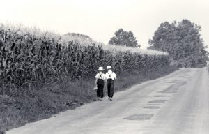 Two Amish children walk together
