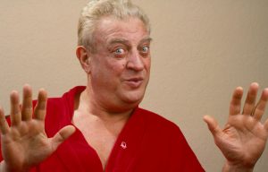 Rodney Dangerfield holding up his hands and making a face