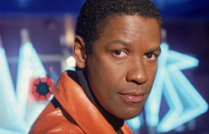 Denzel Washington wearing an orange leather coat